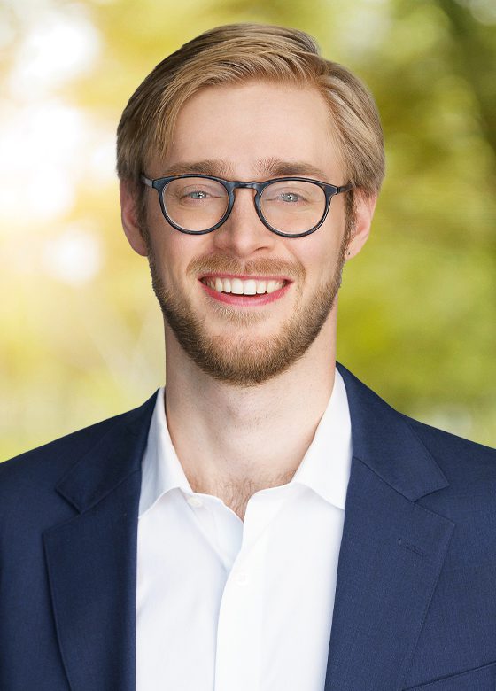 Image of Lars Odland in front of green background